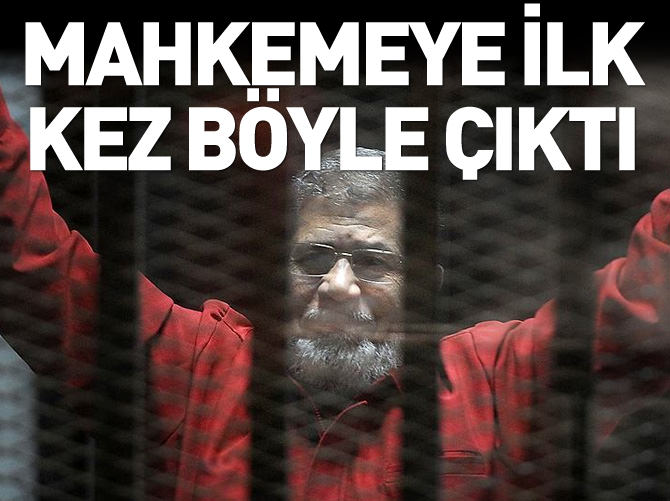 Mursi, "ilk kez idam mahkumu kıyafetiyle" mahkemede